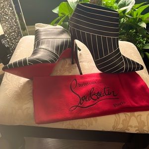 Never worn, brand new Christian Louboutin shoe boot!